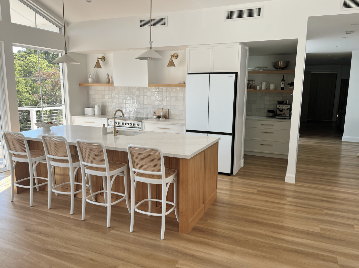 Newly installed and cleaned hybrid flooring kitchen area.