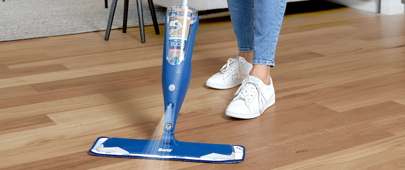 Bona Timber Spray Mop with a sturdy trigger handle, rotating mop head, and refillable cartridge. Designed for cleaning and maintaining timber floors, it includes a microfiber pad for streak-free results and efficient dirt removal.